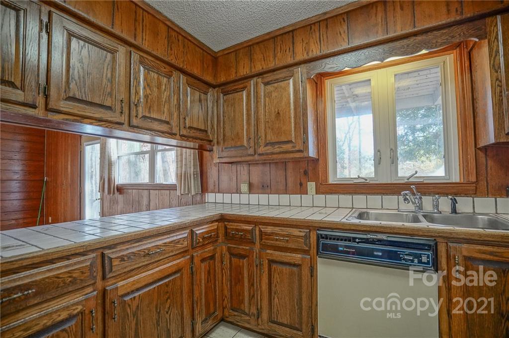 640 Coley Road Salisbury, NC 28146 - Photo 26 of 43 a kitchen with stainless steel appliances granite countertop a sink and cabinets