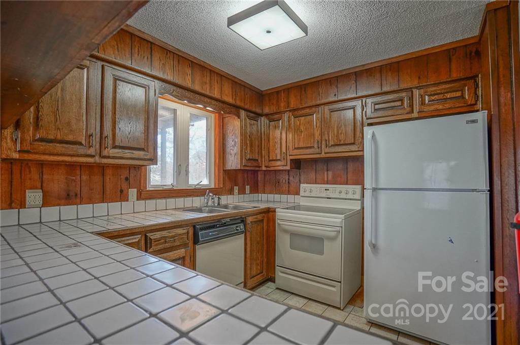 640 Coley Road Salisbury, NC 28146 - Photo 28 of 43 a kitchen with stainless steel appliances granite countertop a refrigerator and a sink