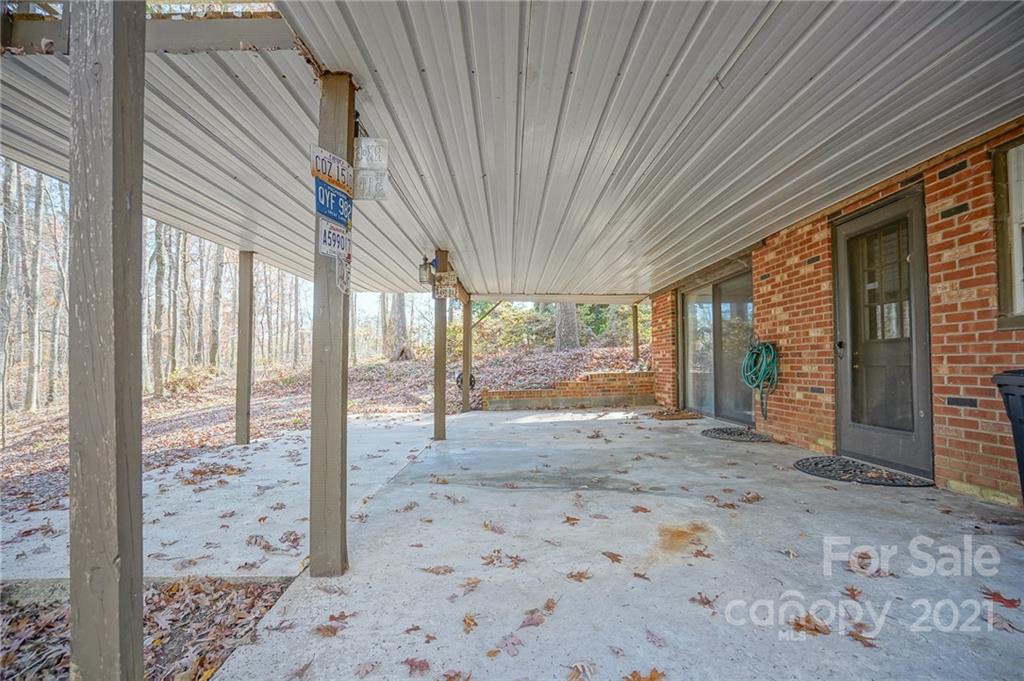 640 Coley Road Salisbury, NC 28146 - Photo 38 of 43 a view of a porch with a table and chairs