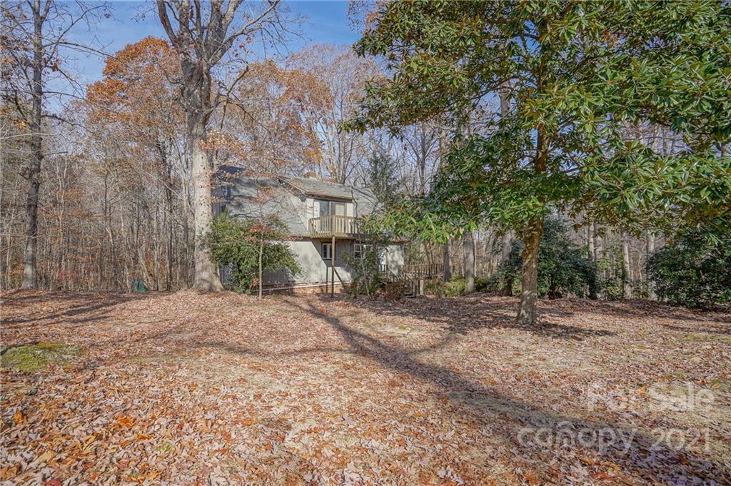 640 Coley Road Salisbury, NC 28146 - Photo 41 of 43 a backyard of a house with large trees and plants
