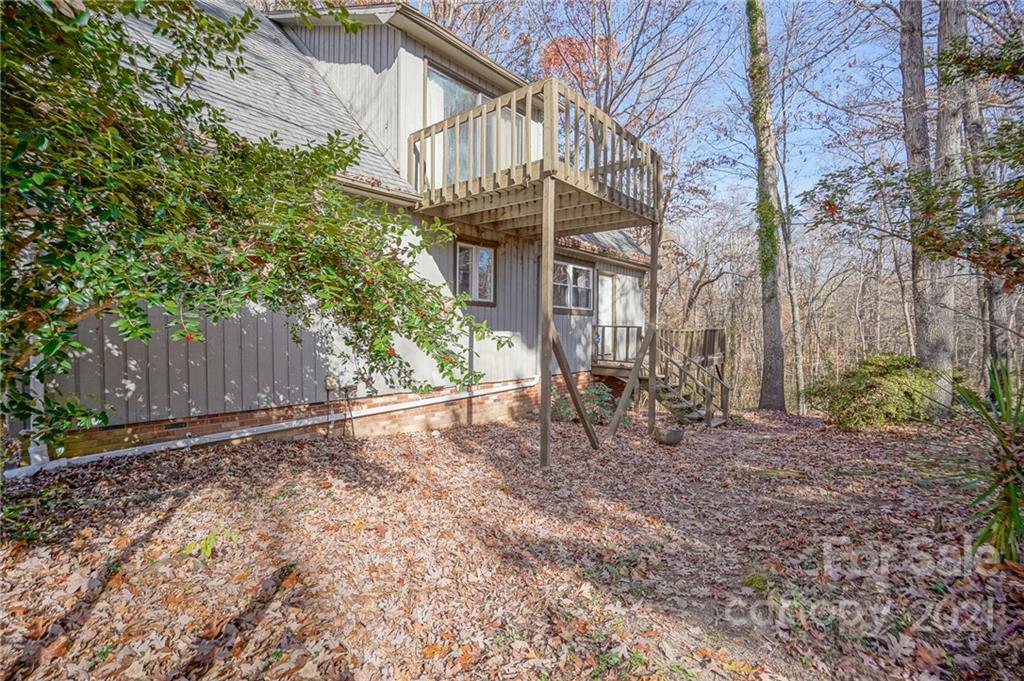 640 Coley Road Salisbury, NC 28146 - Photo 43 of 43 a backyard of a house with large trees and wooden fence