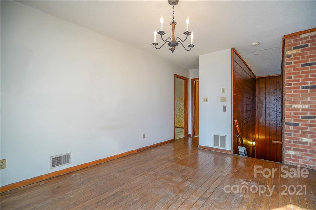 640 Coley Road Salisbury, NC 28146 - Photo 9 of 43 a view of an empty room with wooden floor and a window