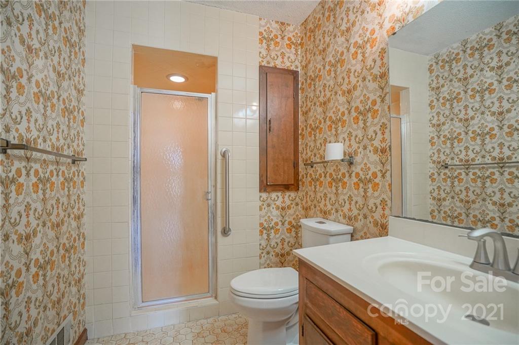 640 Coley Road Salisbury, NC 28146 - Photo 10 of 43 a bathroom with a granite countertop sink toilet and shower