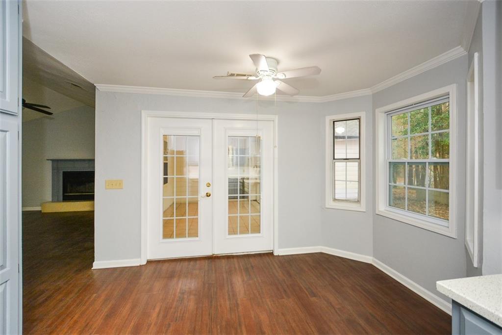 1413 Reed Lane Woodstock, GA 30189 - Photo 17 of 68 a view of an empty room with wooden floor and a window