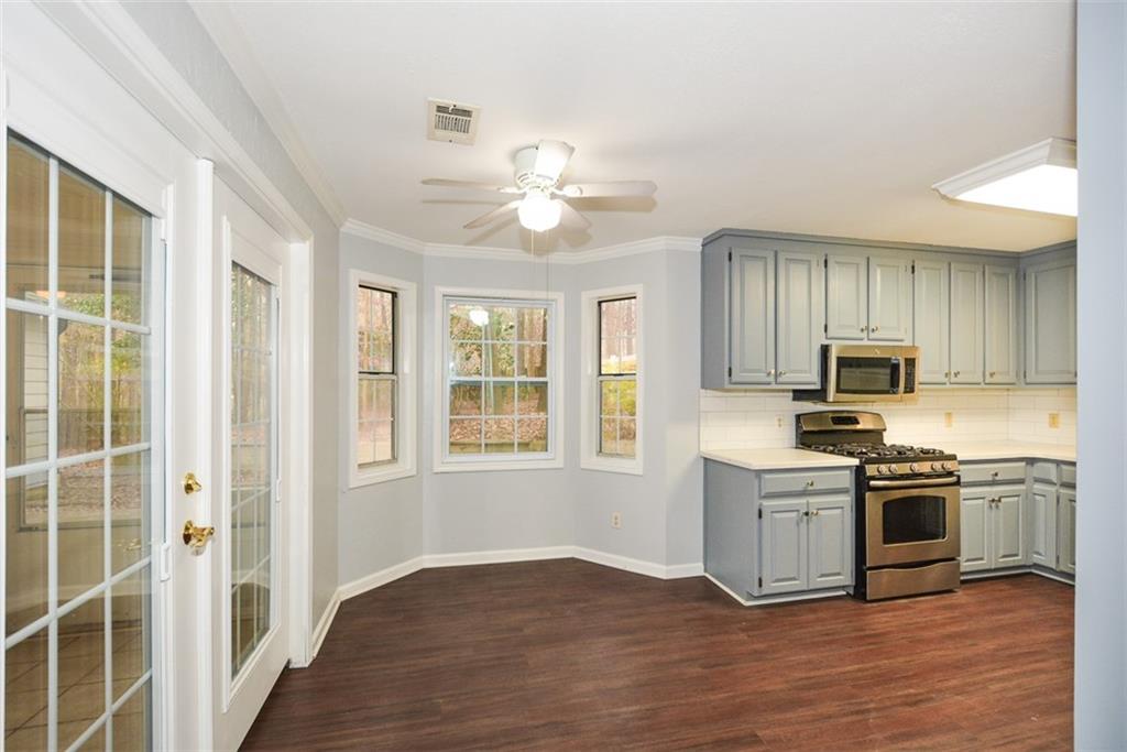 1413 Reed Lane Woodstock, GA 30189 - Photo 18 of 68 a kitchen with a stove oven and sink
