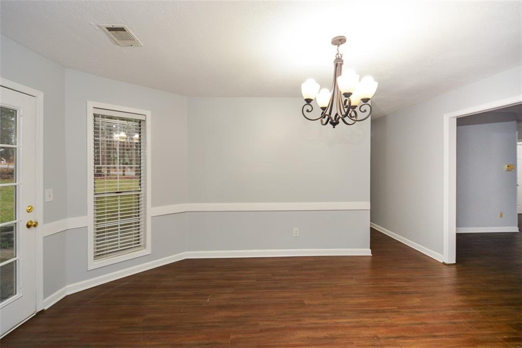 1413 Reed Lane Woodstock, GA 30189 - Photo 20 of 68 a view of empty room with wooden floor and fan