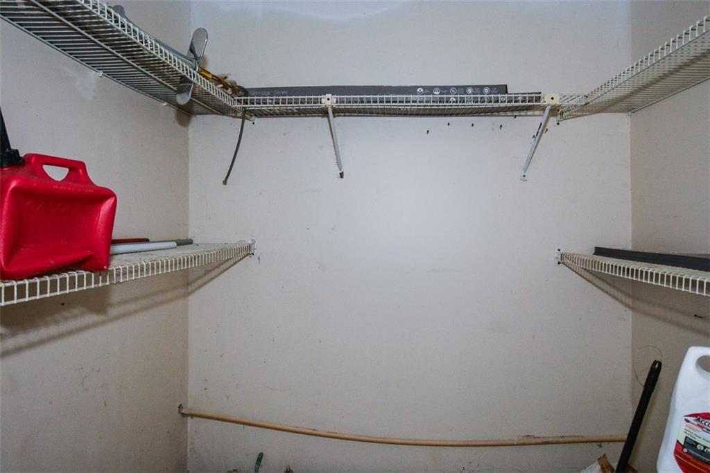 1413 Reed Lane Woodstock, GA 30189 - Photo 22 of 68 a view of small space with racks on the wall