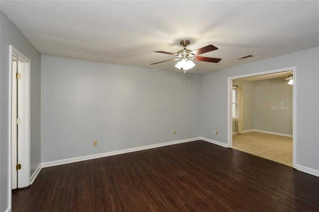 1413 Reed Lane Woodstock, GA 30189 - Photo 24 of 68 wooden floor in an empty room with a window