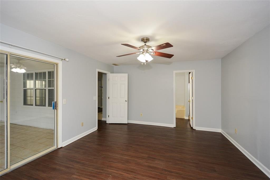 1413 Reed Lane Woodstock, GA 30189 - Photo 26 of 68 a view of an empty room with wooden floor