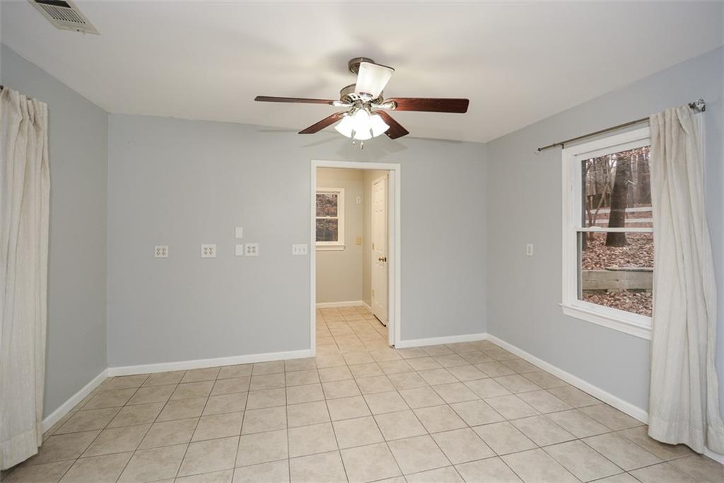1413 Reed Lane Woodstock, GA 30189 - Photo 27 of 68 wooden floor in an empty room with a window