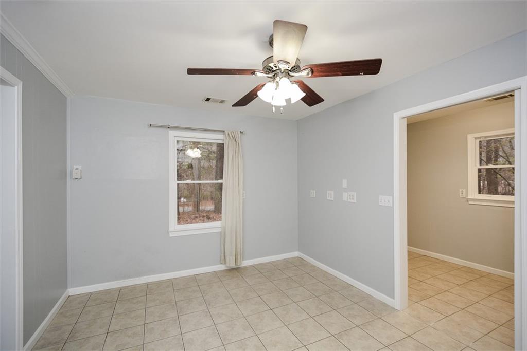 1413 Reed Lane Woodstock, GA 30189 - Photo 28 of 68 a view of an empty room with a window