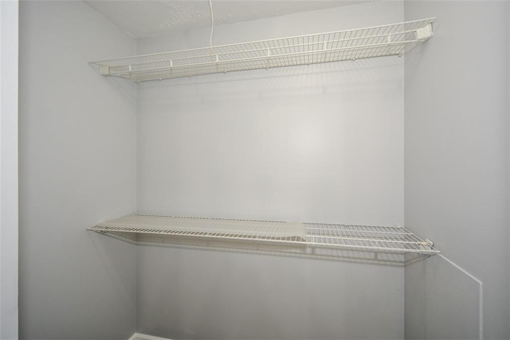 1413 Reed Lane Woodstock, GA 30189 - Photo 34 of 68 a view of a room with racks on the wall