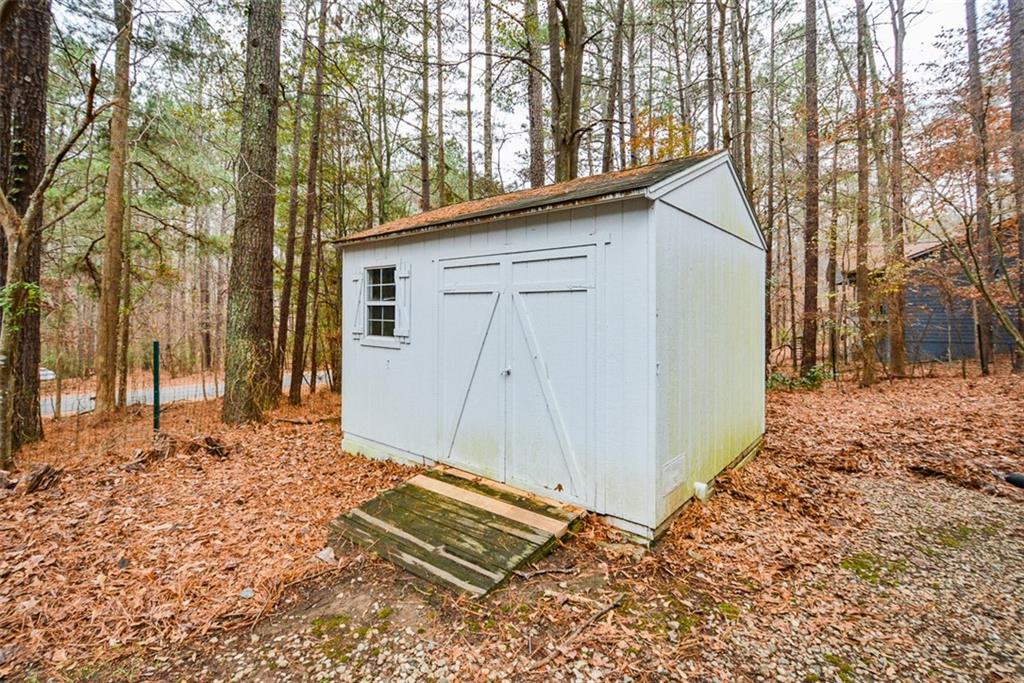 1413 Reed Lane Woodstock, GA 30189 - Photo 46 of 68 a view of a house with a yard