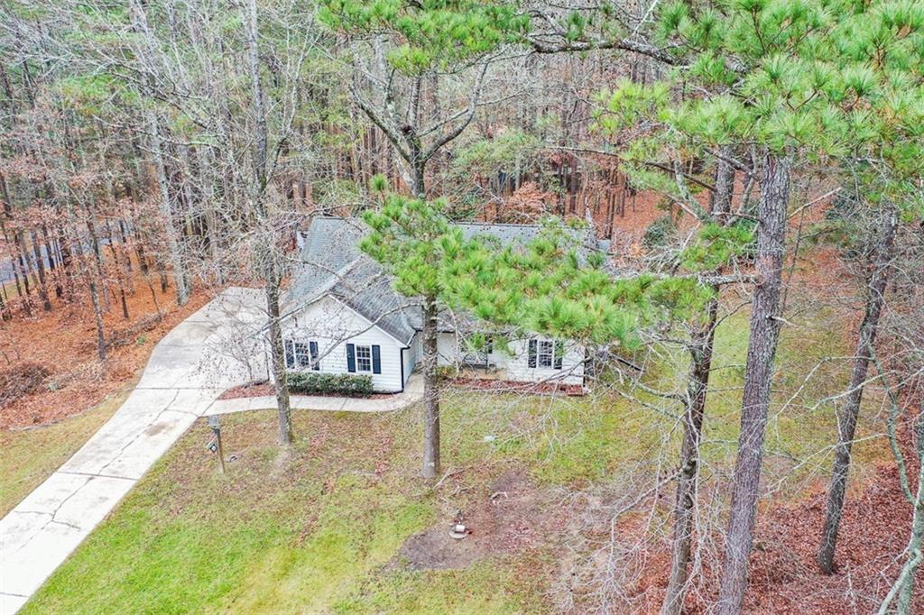 1413 Reed Lane Woodstock, GA 30189 - Photo 55 of 68 a view of a house with a yard and sitting area