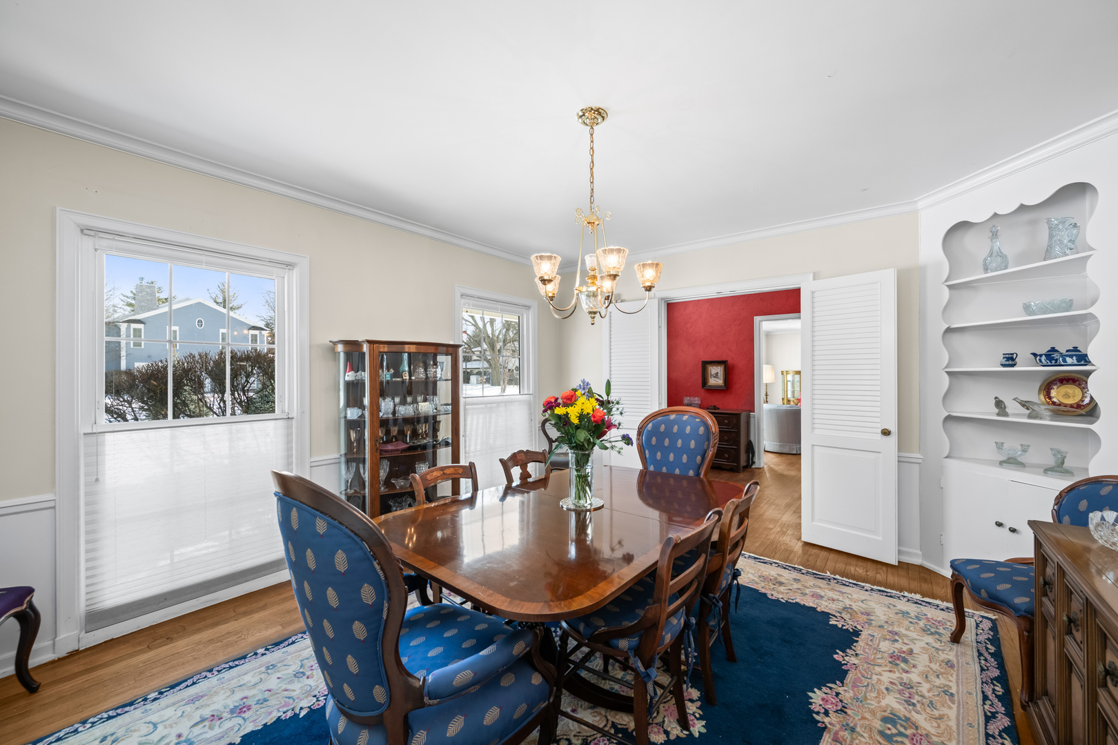 1011 Mohawk Road Wilmette, IL 60091 - Photo 2 of 11 a dining room with furniture a chandelier and wooden floor