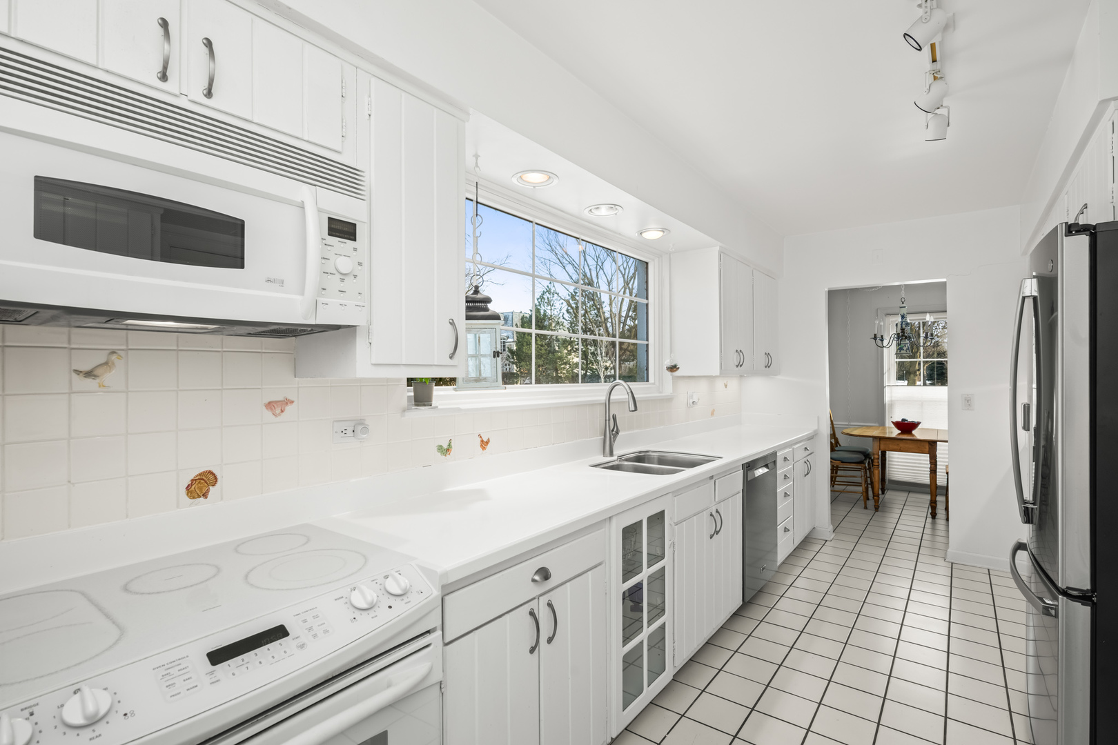 1011 Mohawk Road Wilmette, IL 60091 - Photo 7 of 11 a view of a kitchen with a sink and cabinets