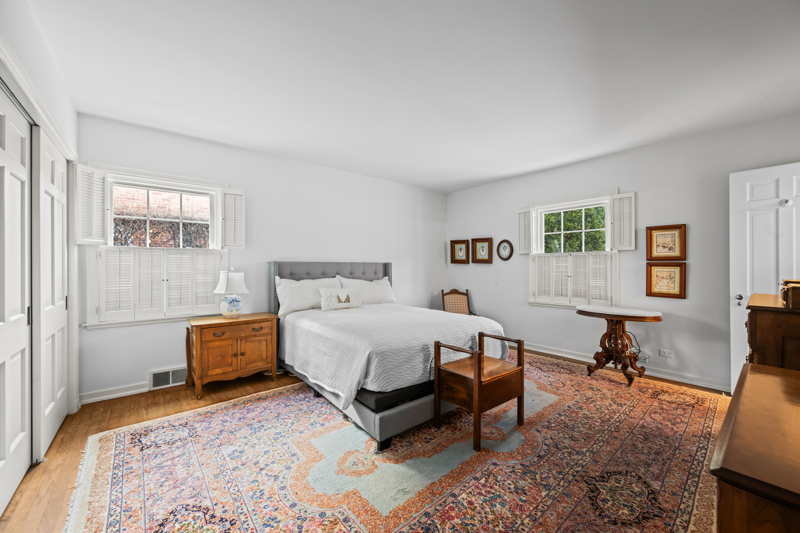 1011 Mohawk Road Wilmette, IL 60091 - Photo 9 of 11 a bedroom with a bed a table and chair