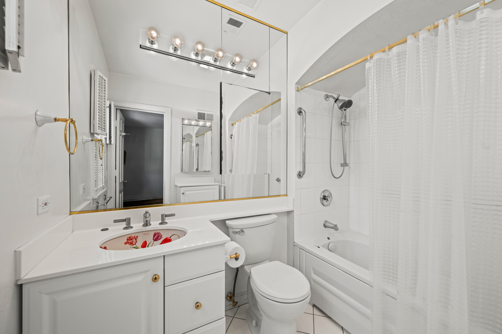 1011 Mohawk Road Wilmette, IL 60091 - Photo 10 of 11 a bathroom with a sink toilet vanity and shower