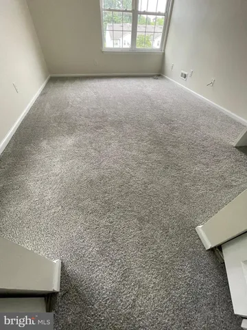 a bath tub sitting next to a white sink