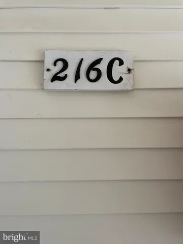a view of a livingroom with furniture and staircase
