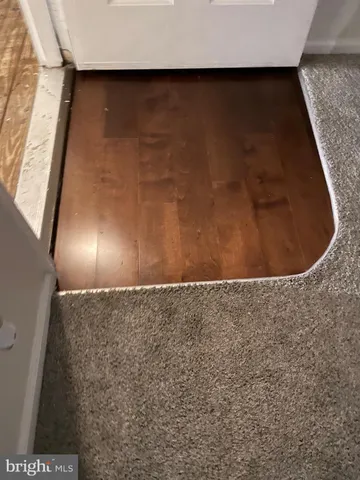 a view of an empty room with a fireplace