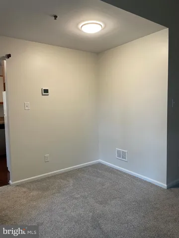 a kitchen with granite countertop a stove and a sink