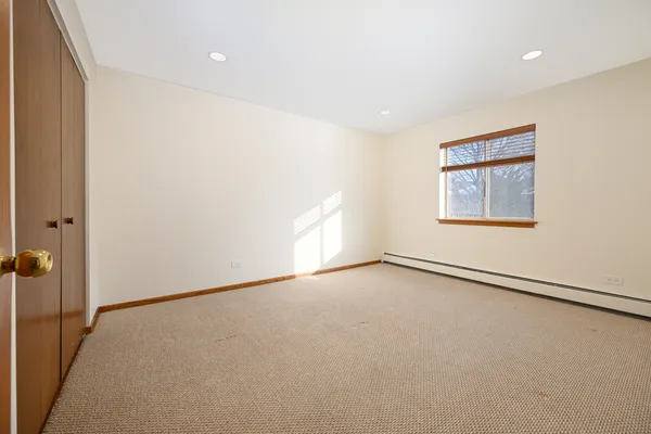 an empty room with a empty space and window