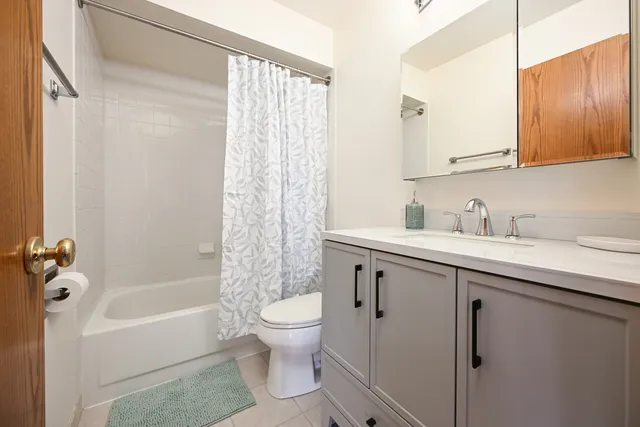 a bathroom with a sink a toilet and bathtub