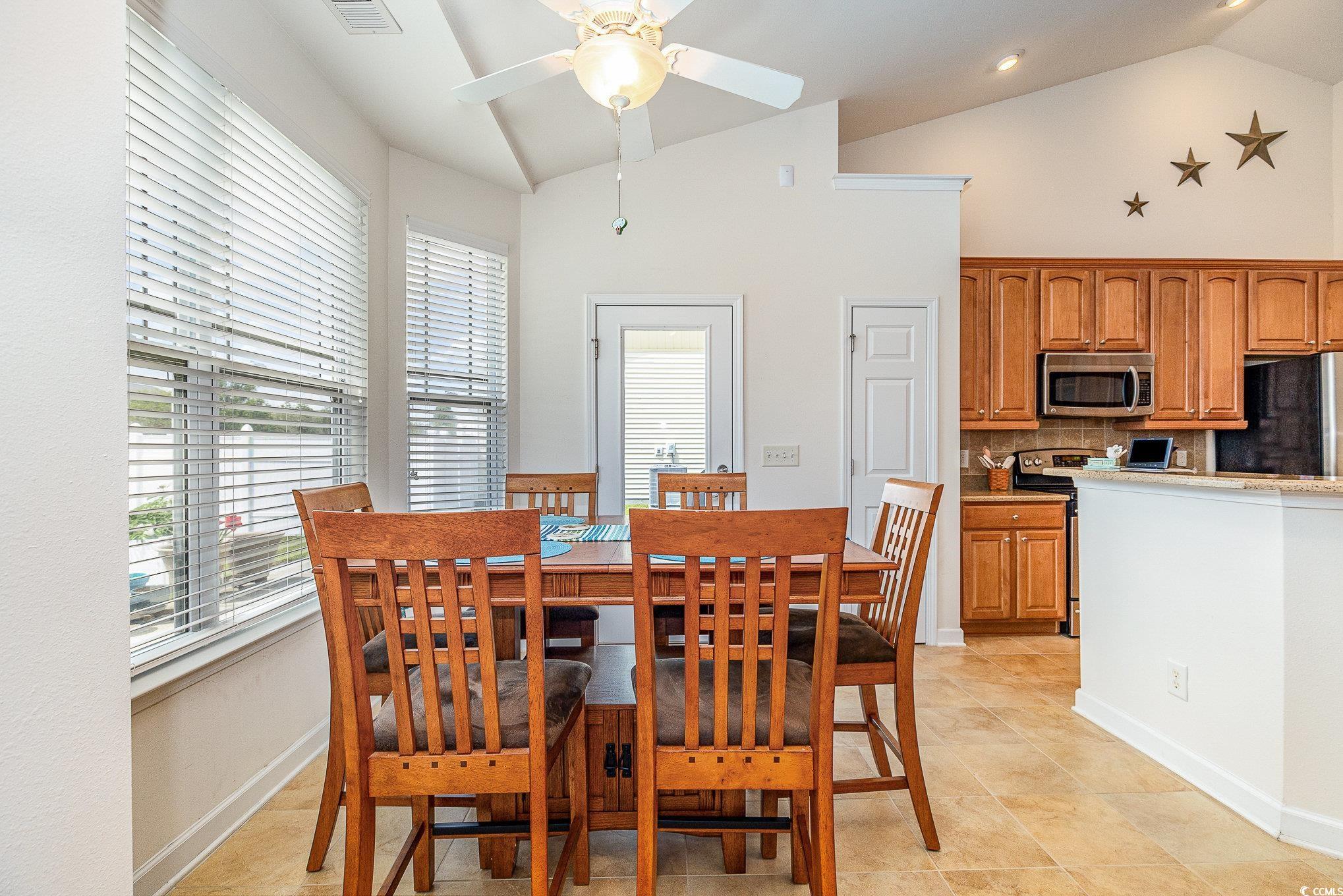 541 Miromar Way Myrtle Beach, SC 29588 - Photo 12 of 37 Dining area featuring a healthy amount of sunlight