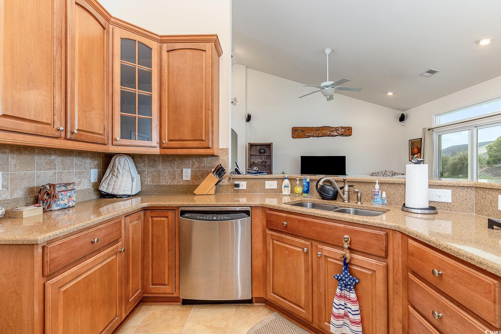 541 Miromar Way Myrtle Beach, SC 29588 - Photo 14 of 37 Kitchen with backsplash, light stone countertops,