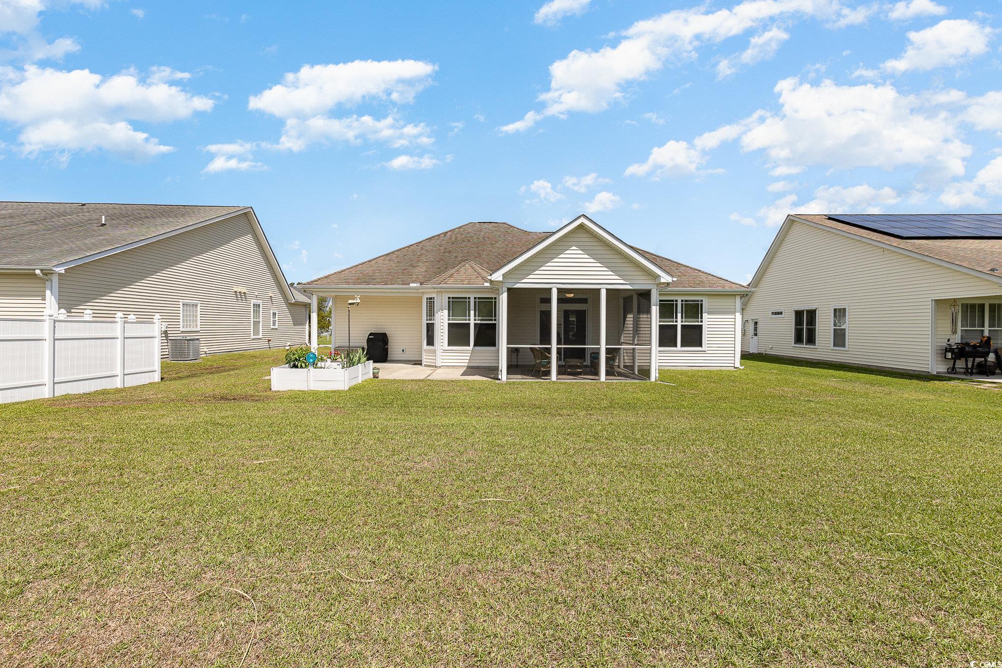 541 Miromar Way Myrtle Beach, SC 29588 - Photo 28 of 37 Rear view of house featuring a shingled roof, a su