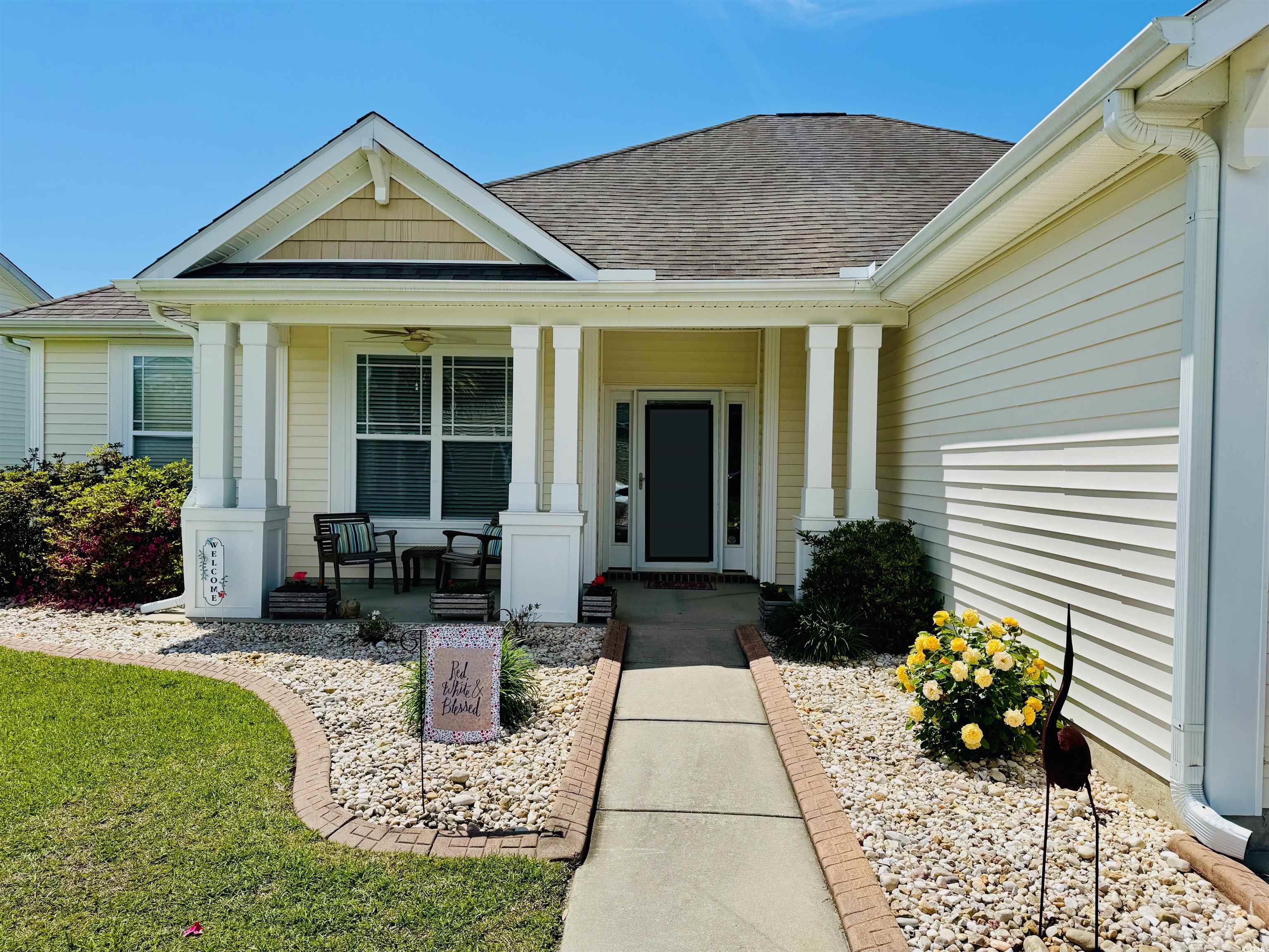 541 Miromar Way Myrtle Beach, SC 29588 - Photo 3 of 37 Entrance to property featuring a porch and roof wi