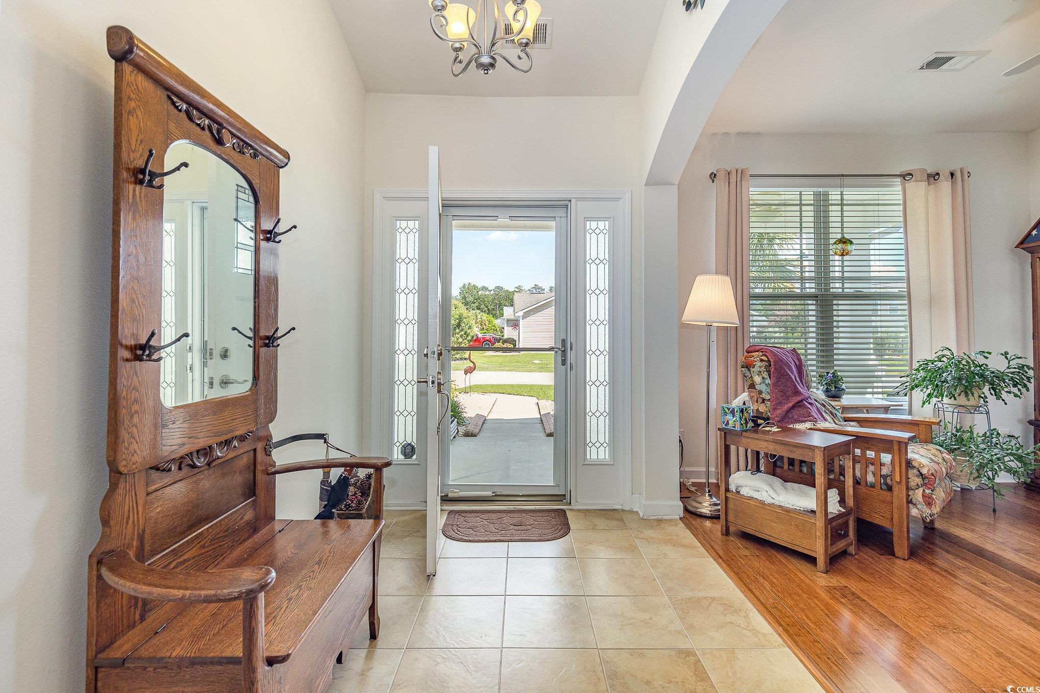 541 Miromar Way Myrtle Beach, SC 29588 - Photo 6 of 37 Foyer featuring light tile patterned floors, arche