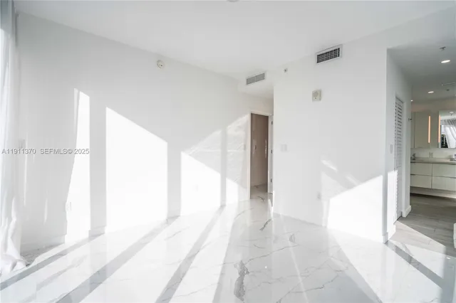 a view of a bathroom with a tub and shower