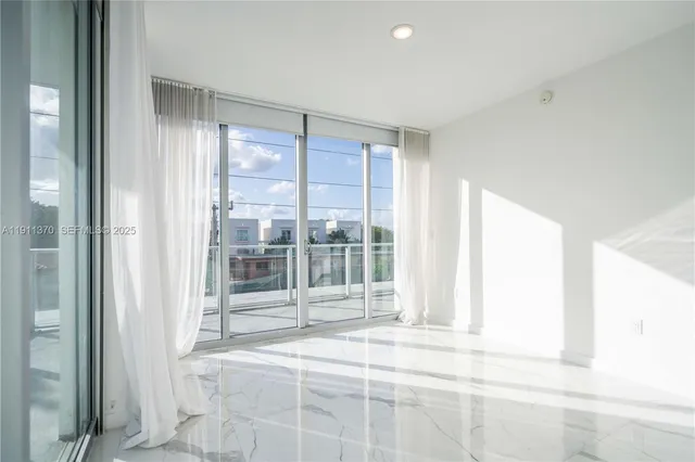 a view of a room with a large window