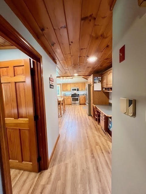 144 Walnut Plain Road Rochester, MA 02770 - Photo 12 of 34 a view of a hallway with wooden floor and staircase