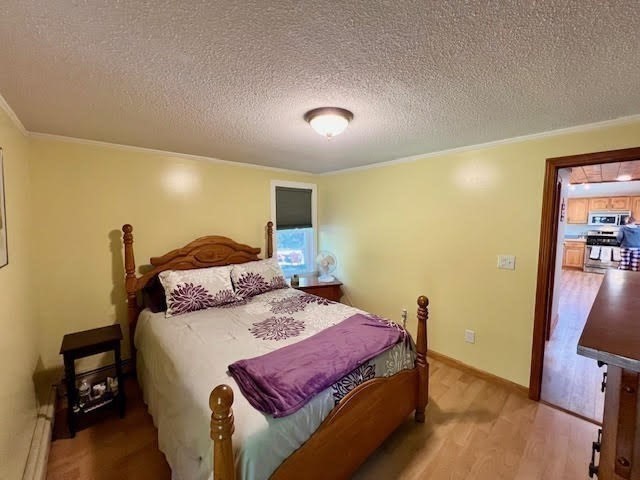144 Walnut Plain Road Rochester, MA 02770 - Photo 21 of 34 a spacious bedroom with a bed and a view of kitchen