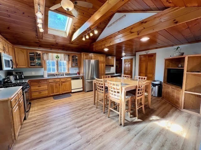 144 Walnut Plain Road Rochester, MA 02770 - Photo 8 of 34 a view of a dining room with furniture window and wooden floor