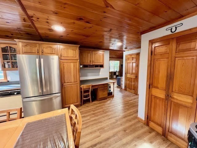 144 Walnut Plain Road Rochester, MA 02770 - Photo 10 of 34 a kitchen with granite countertop wooden floors and stainless steel appliances
