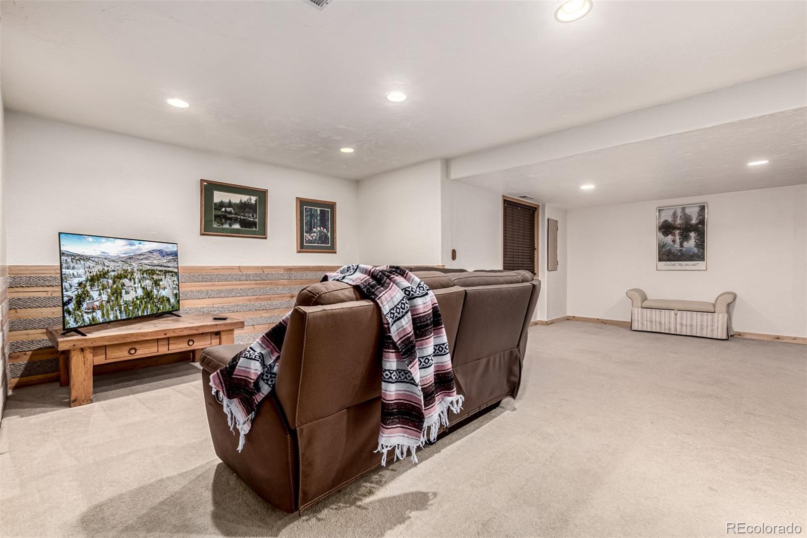 308 Red Hawk Circle Silverthorne, CO 80498 - Photo 33 of 48 a living room with furniture