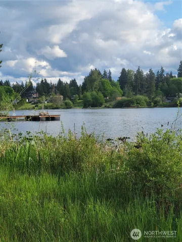 a view of lake with green space