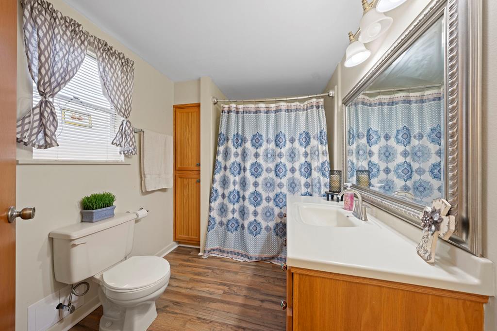 133 Myrtle Avenue Harper, TX 78631 - Photo 11 of 25 a bathroom with a sink toilet and shower