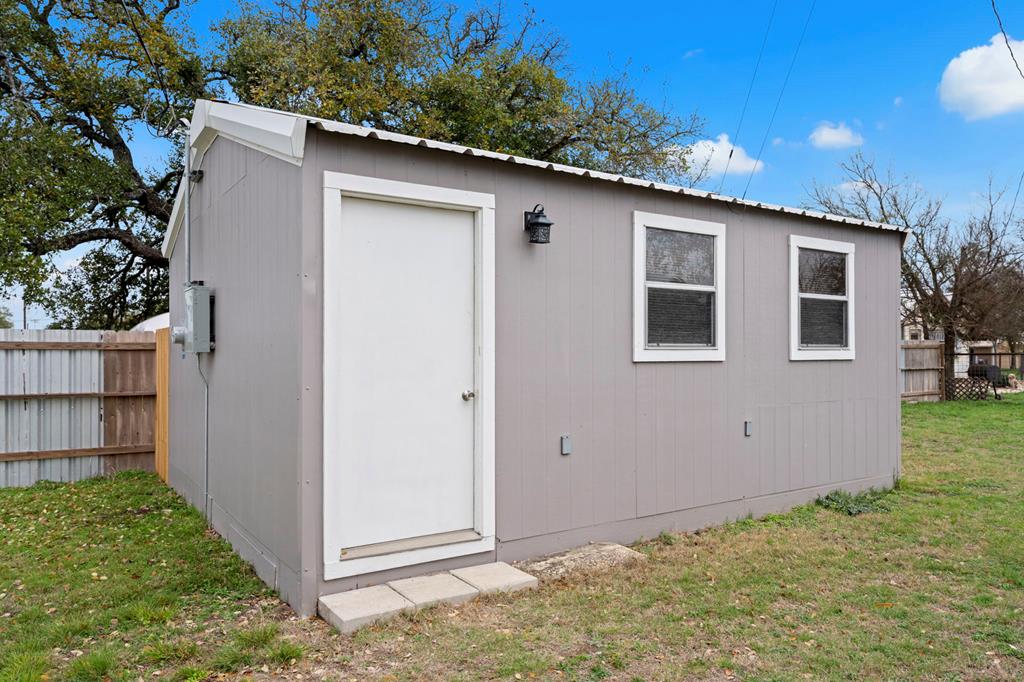 133 Myrtle Avenue Harper, TX 78631 - Photo 17 of 25 a backyard of a house with lots of green space