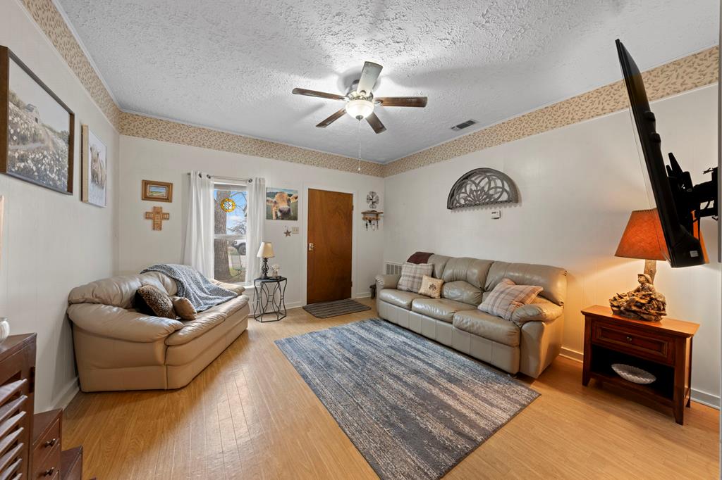 133 Myrtle Avenue Harper, TX 78631 - Photo 4 of 25 a living room with furniture and a flat screen tv