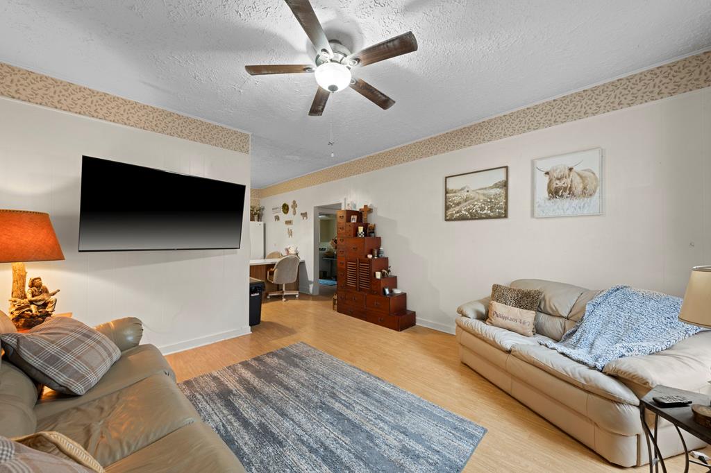 133 Myrtle Avenue Harper, TX 78631 - Photo 5 of 25 a bedroom with furniture and a flat screen tv