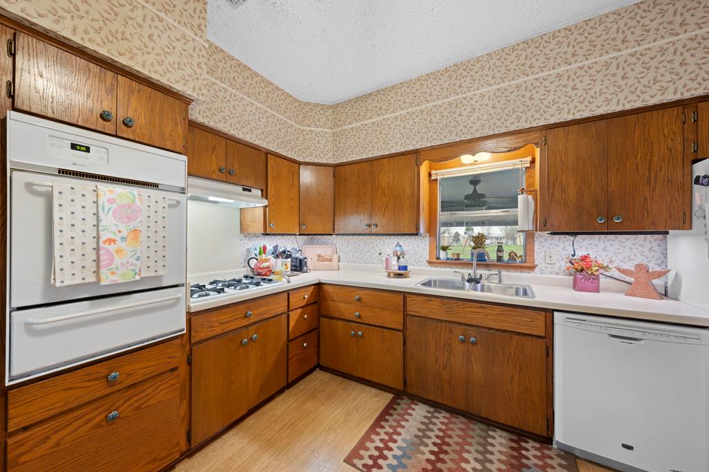 133 Myrtle Avenue Harper, TX 78631 - Photo 7 of 25 a kitchen with sink cabinets and window