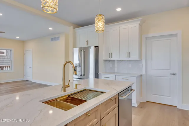 a view of an empty room with a fireplace and a window