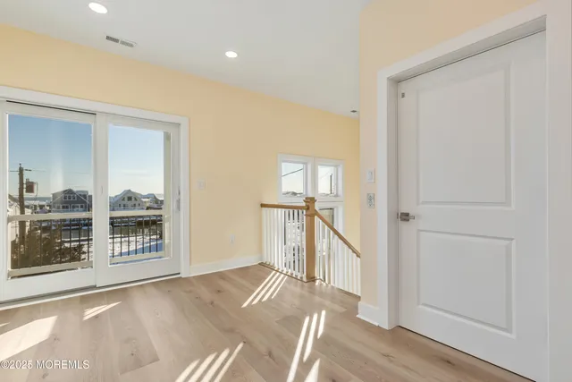 a spacious bathroom with a bathtub and shower