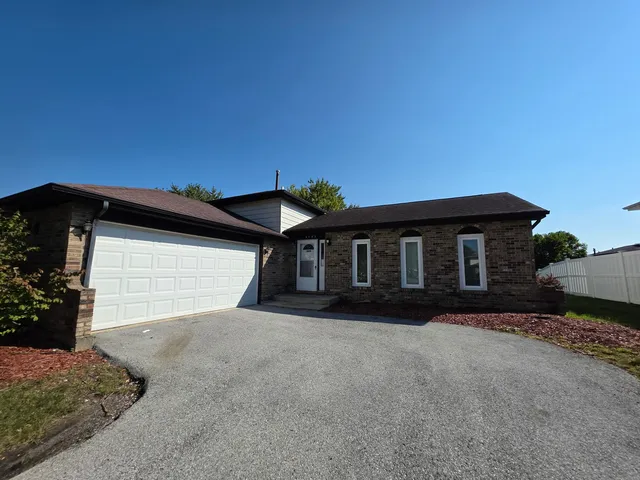 a front view of a house with a garage