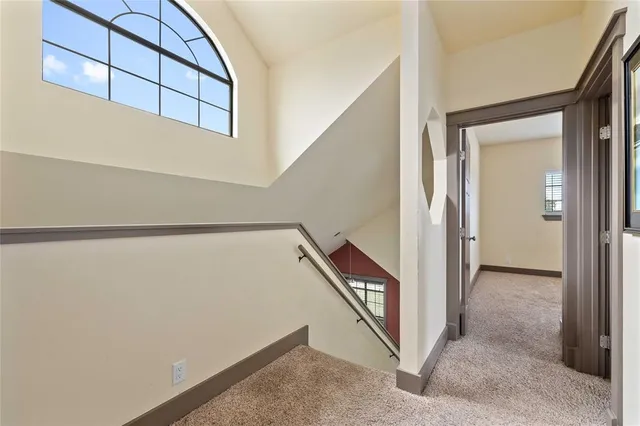 a view of a hallway with staircase